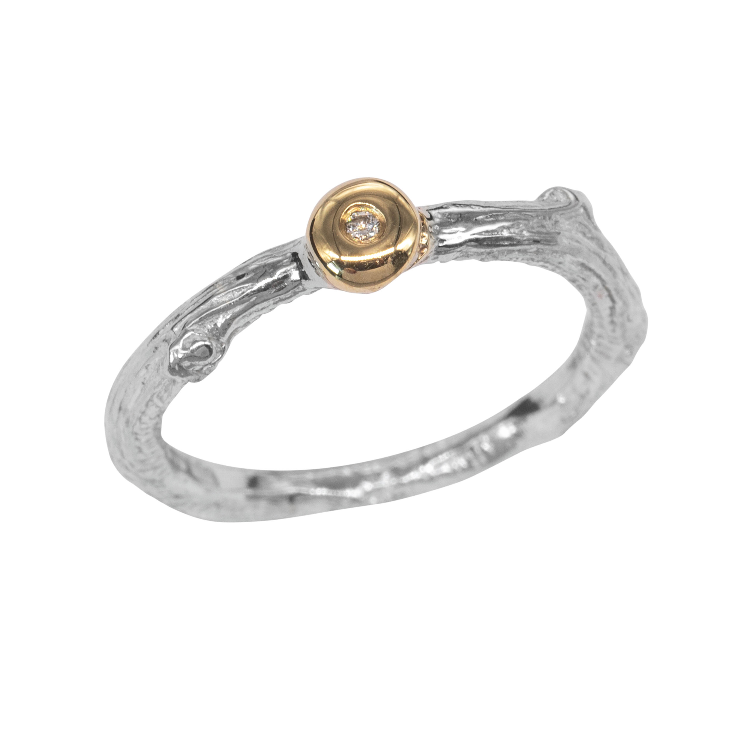 Silver ring with gold bud on front, set with a tiny diamond